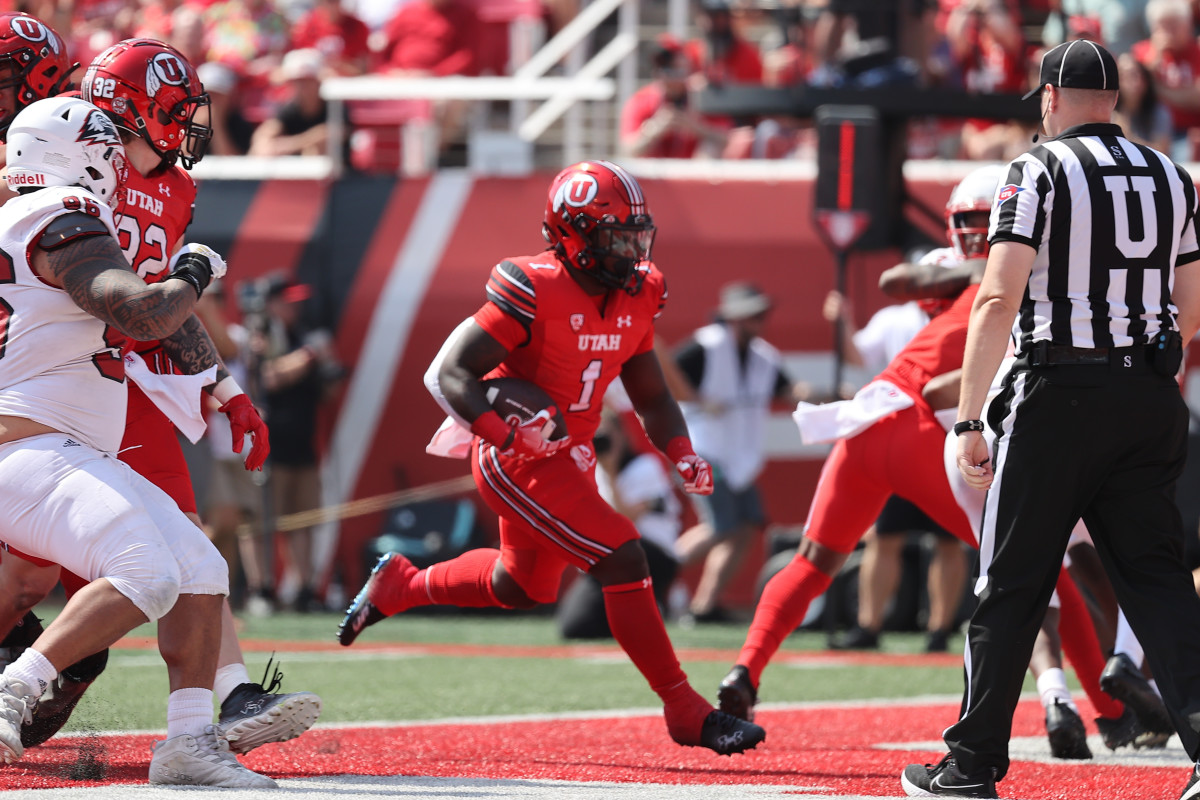 Utah Utes running back Jaylon Glover (1) runs the ball in to the end zone for a touchdown in the third quarter against the Southern Utah Thunderbirds at Rice-Eccles Stadium.